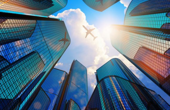 Modern office buildings and airplane