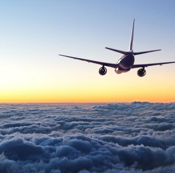 Jet in sky above clouds